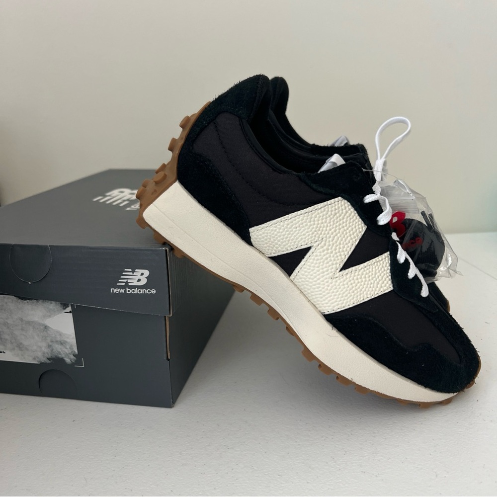 New Balance Woman’s Black and White Sneakers